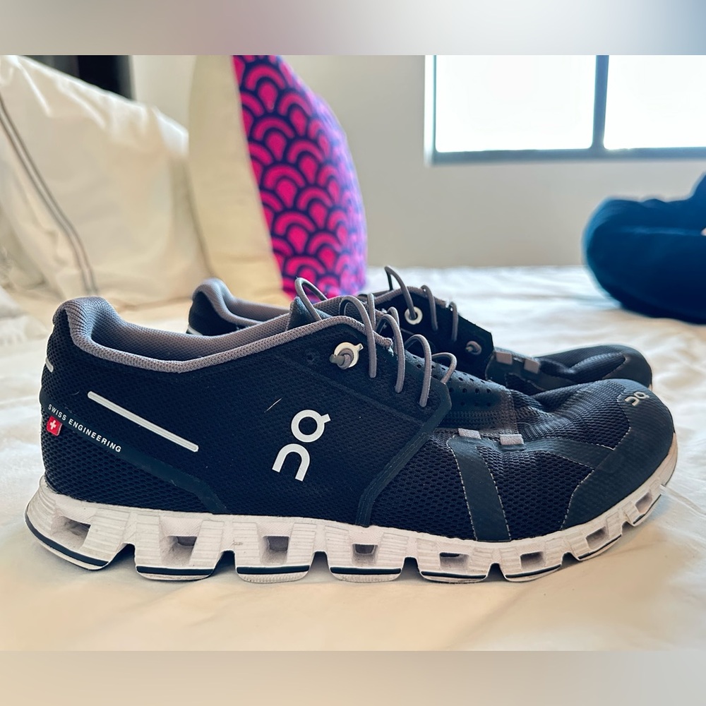 On Running Black and White Athletic Shoes with Cloud Cushioning